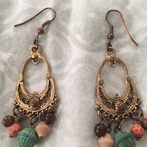 Gold tone dangle earrings with beads
